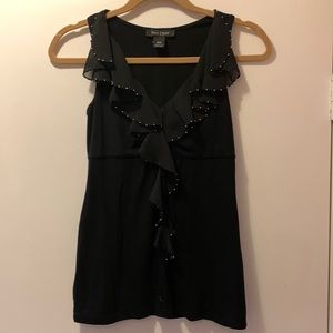 Black blouse with silver ruffled beading along the neckline and down the front.